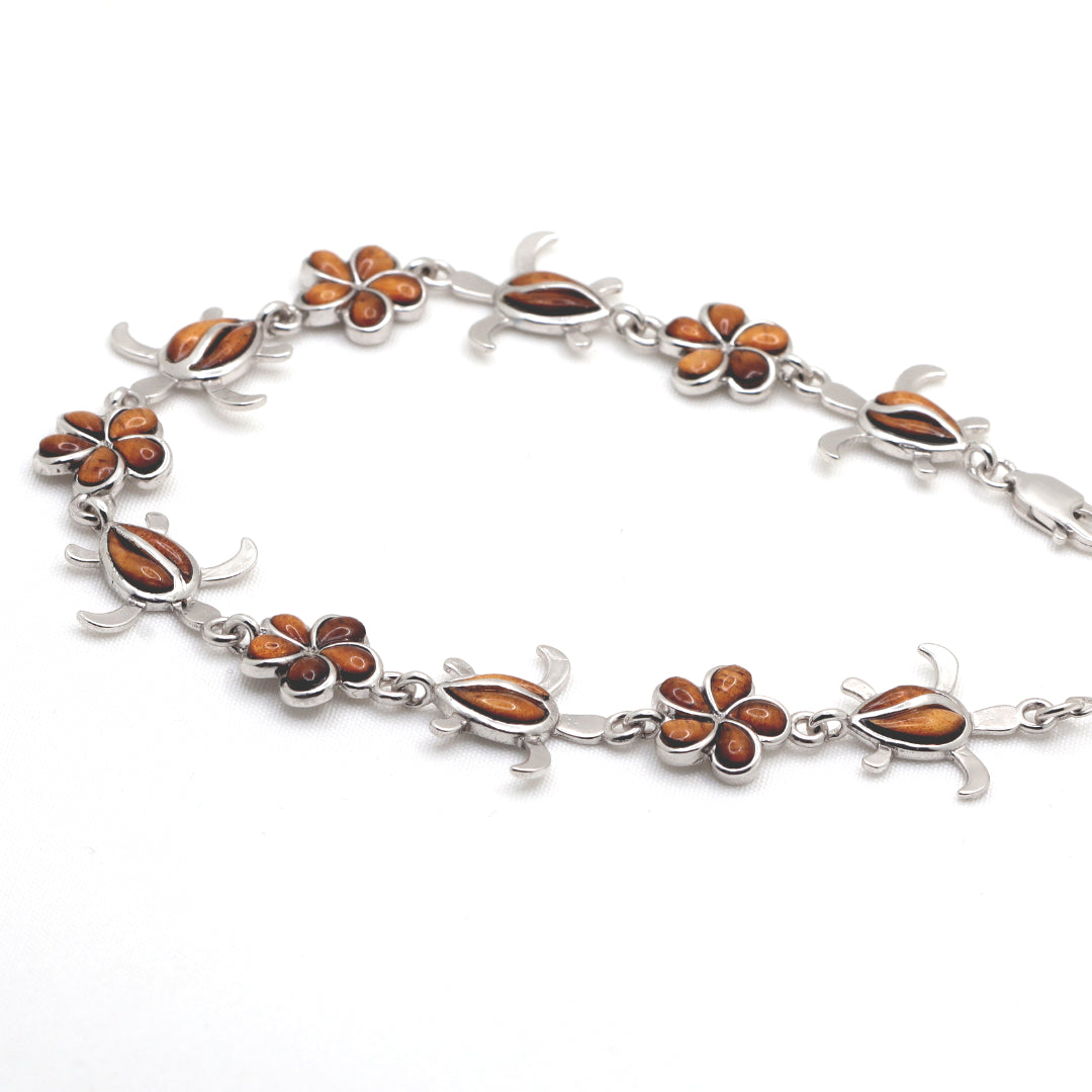 Silver bracelet with sea turtle and plumeria flower
