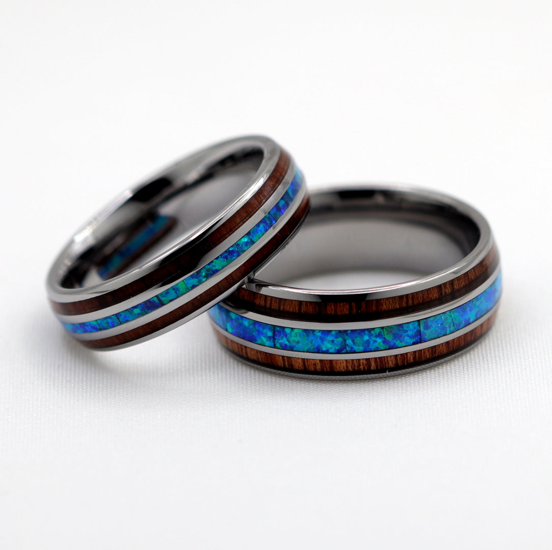 Tungsten ring set with blue opal and koa wood